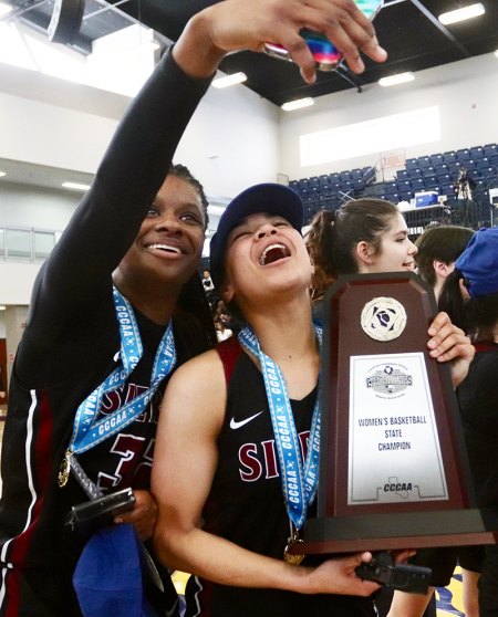 Sierra College women's team show off their championship trophy.